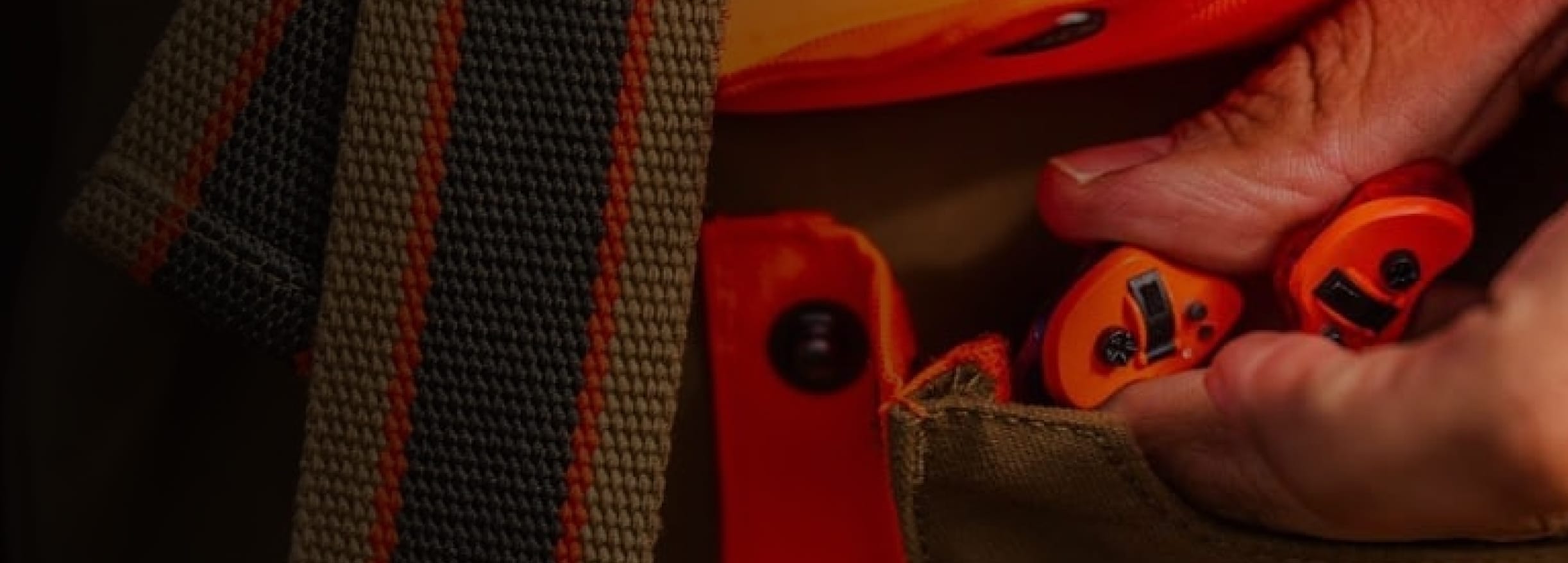 Hunter putting custome edge defense hearing device in pocket